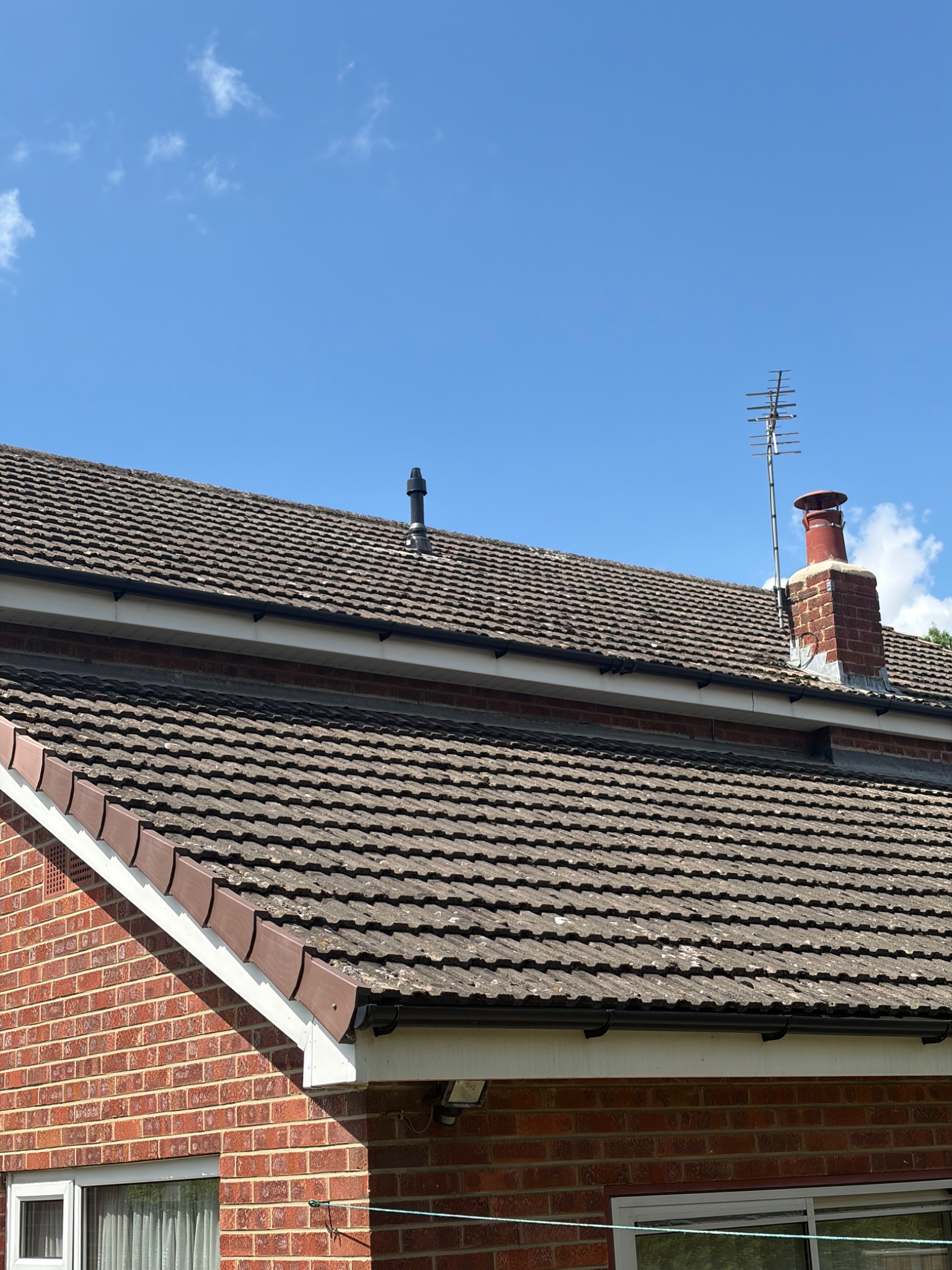 New vertical boiler flue terminal fitted through the roof tiles in Darlington