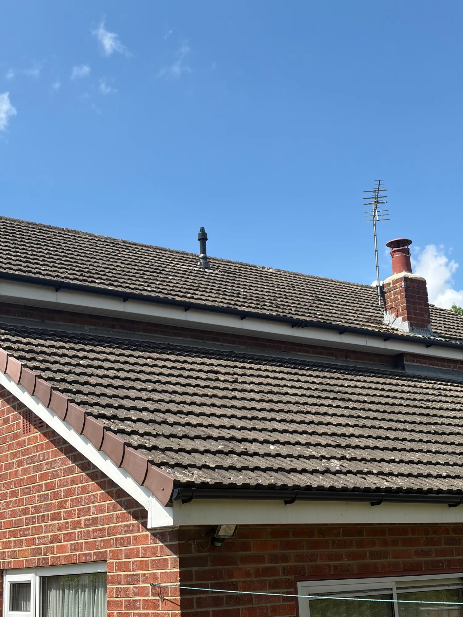 New vertical boiler flue terminal fitted through the roof tiles in Darlington