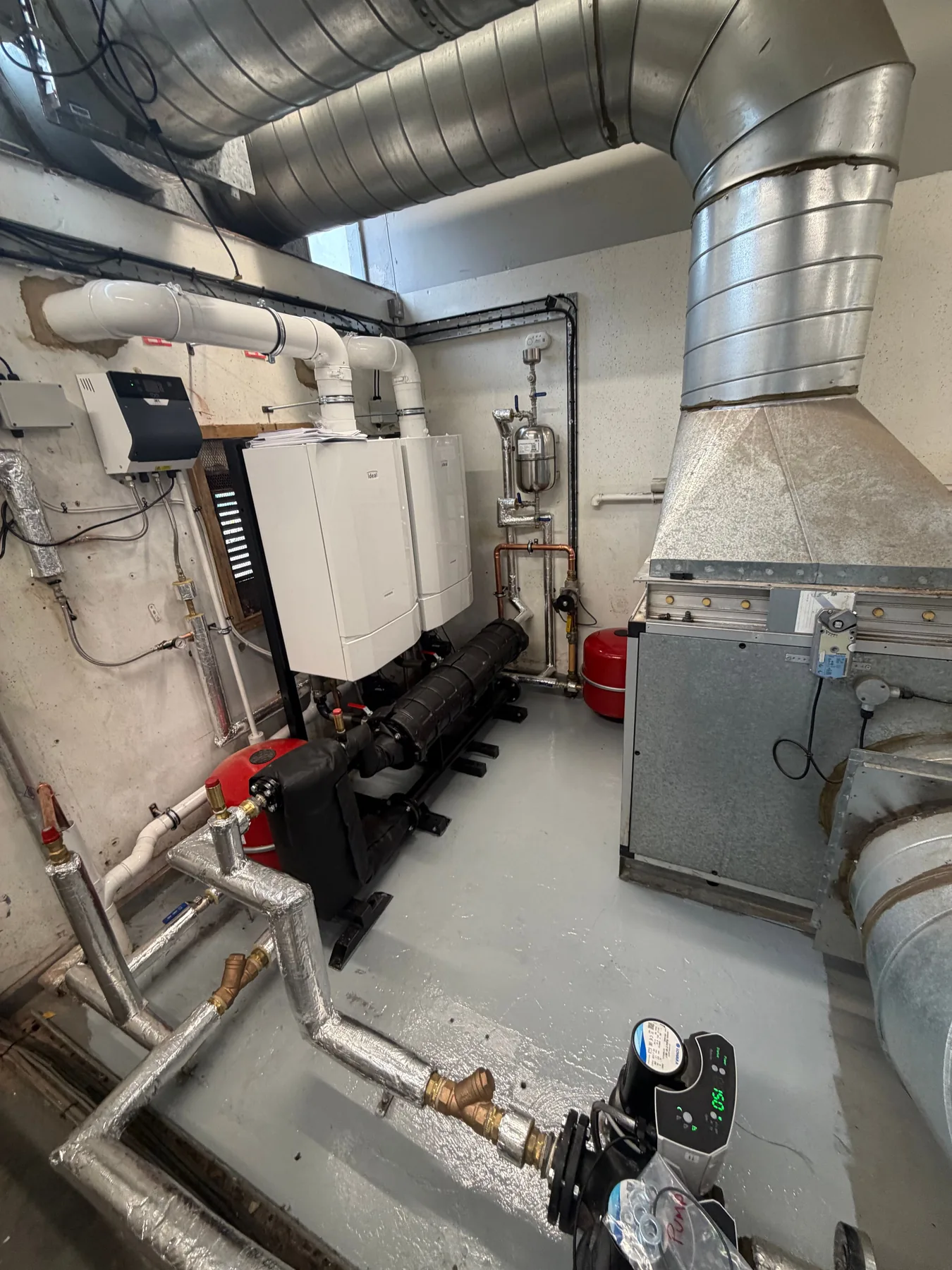 Commercial plant room with twin wall-hung boilers and full copper pipework installed by MCH